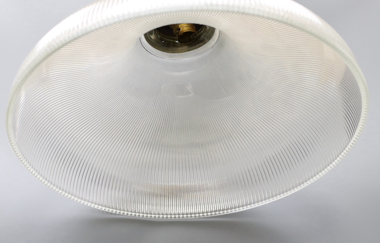 A clear ribbed glass shaded and brass pendant light, shade 37.5 cms diameter.